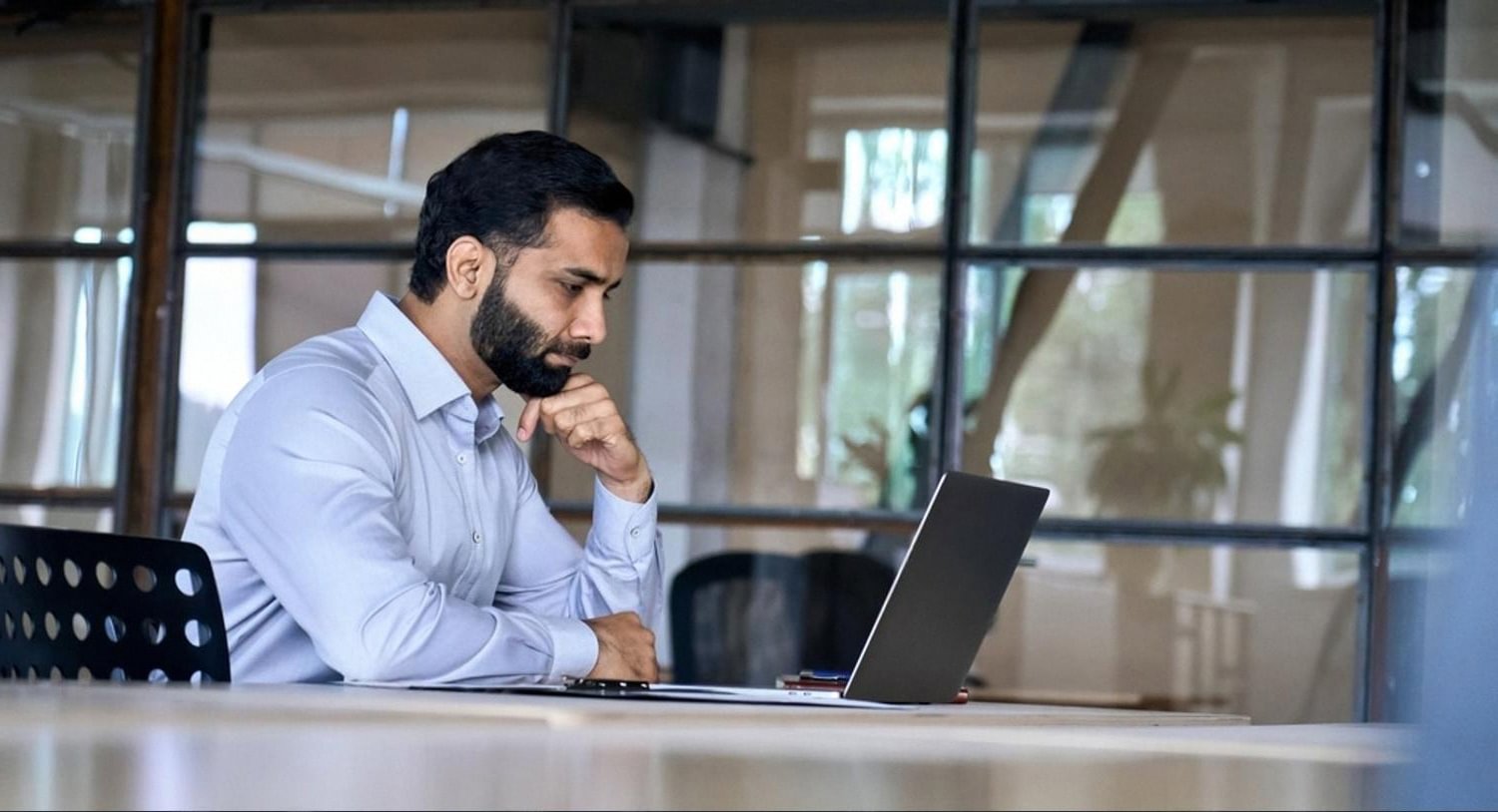 UAE business owner reviewing compliance records on a laptop